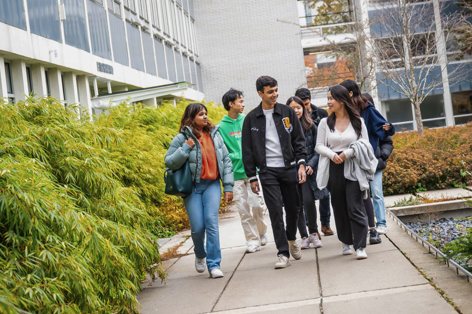 A group of students walking in the Buchanan courtyard at the UBC Vancouver campus